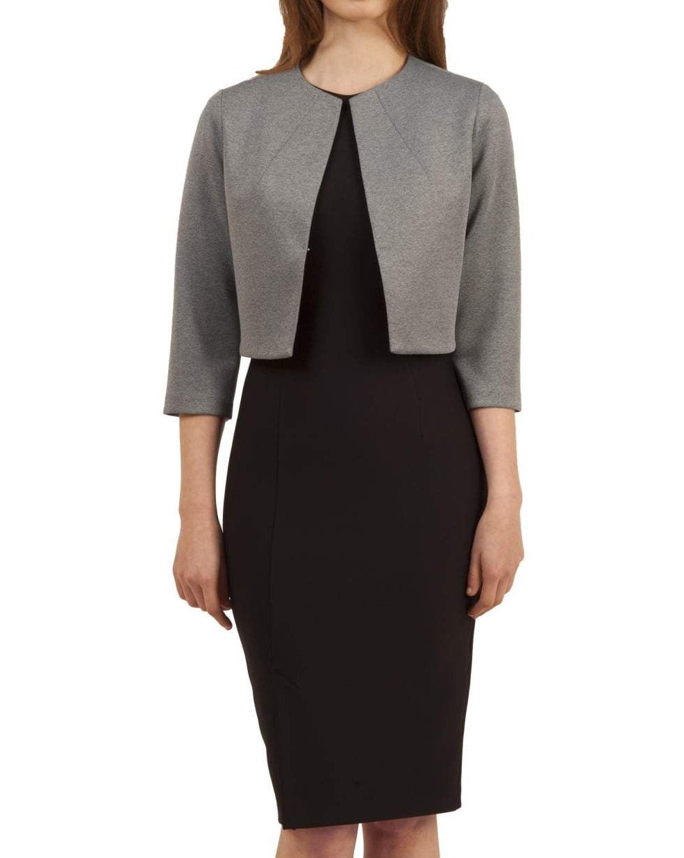 Woman wearing a black dress with a gray jacket on a beige background (Misty Grey)