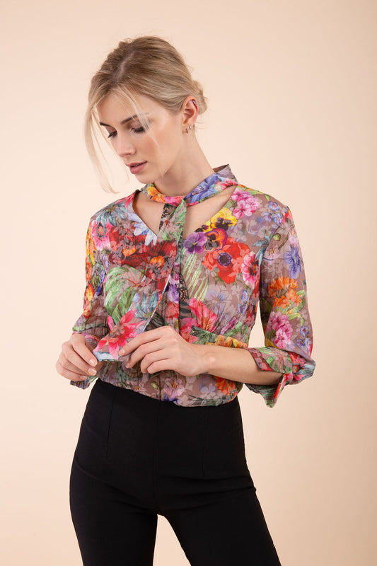 Model is wearing the Diva Branscombe 3/4 Sleeve blouse in floral print taupe front image