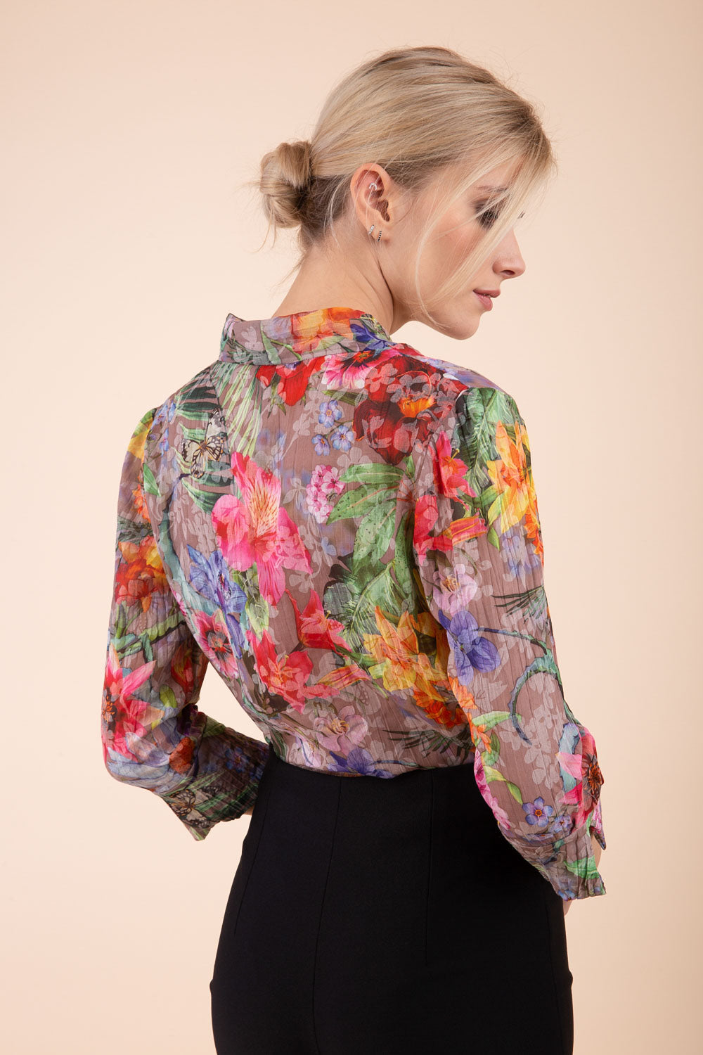 Model is wearing the Diva Branscombe 3/4 Sleeve blouse in floral print taupe front image