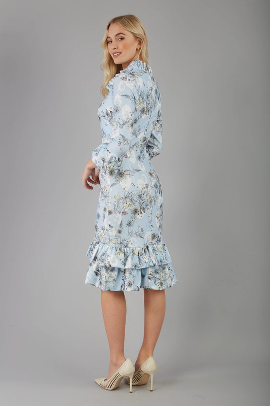 model is wearing diva catwalk fern printed dress with rushes and sleeves in light blue front