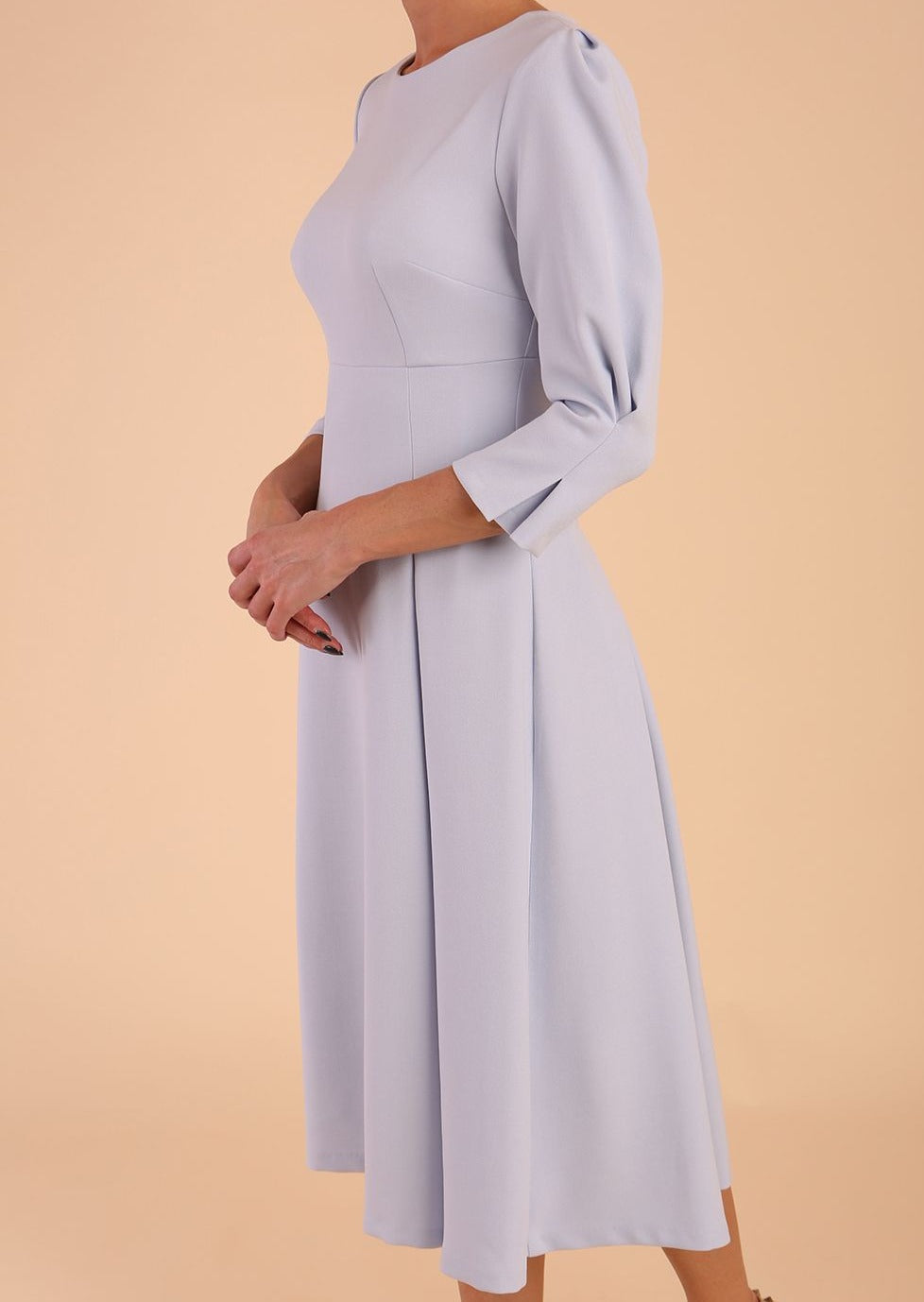 model is wearing diva catwalk harpsden a-line skirt 3/4 sleeve swing dress with rounded neckline in Celestial Blue front side