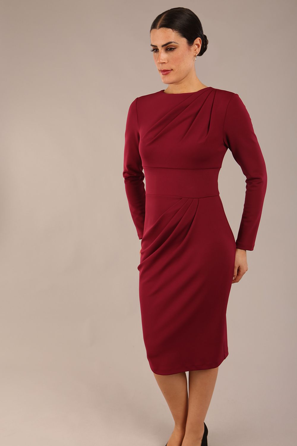 model wearing a diva catwalk Olgivy Long Sleeve Knee Length Pencil Dress round neckline and long sleeve in burgundy colour
