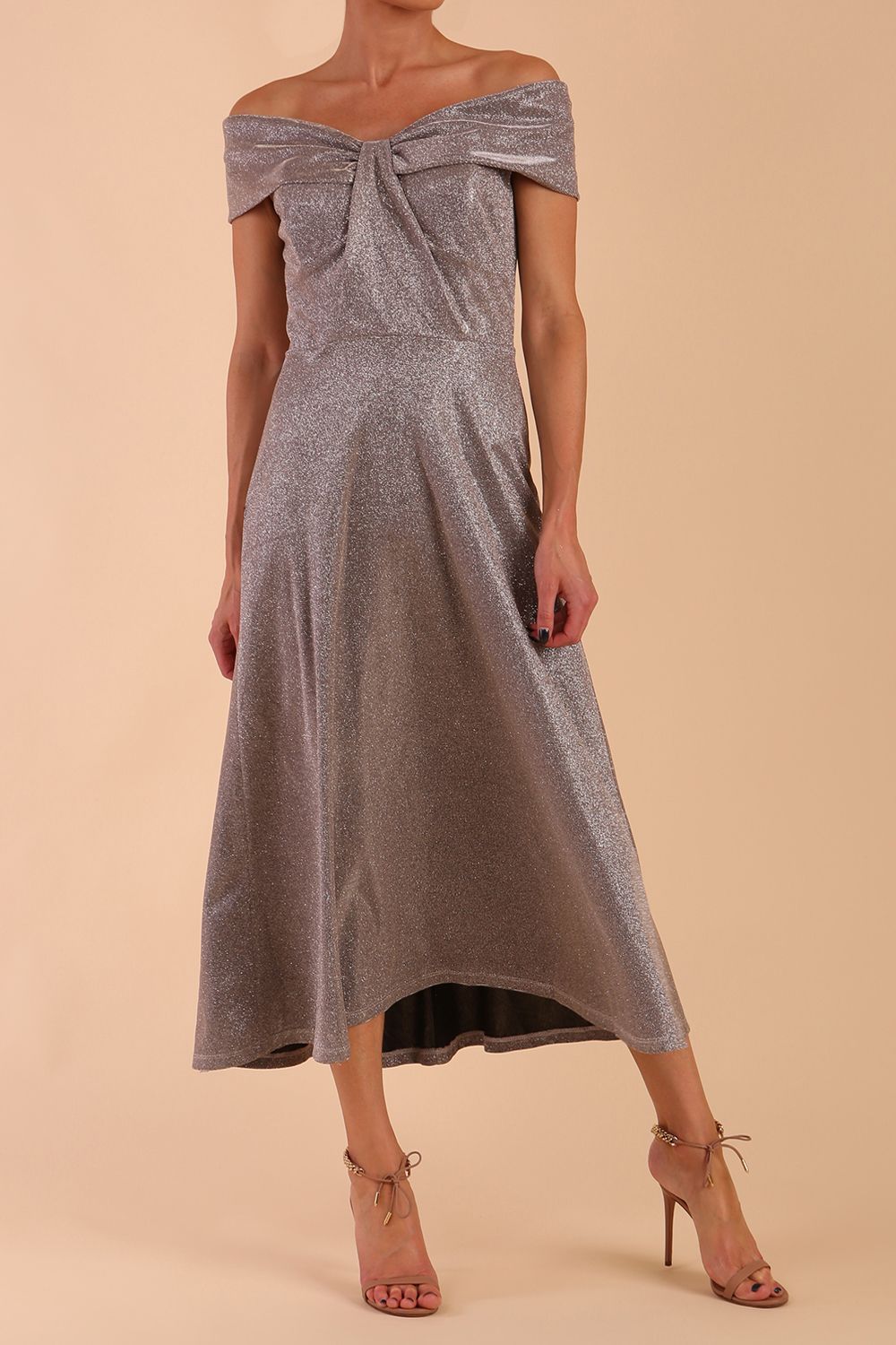 Model is wearing diva catwalk Capri A-Line Midaxi Glitter Dress off the shoulders in Iris Silver Glitter front
