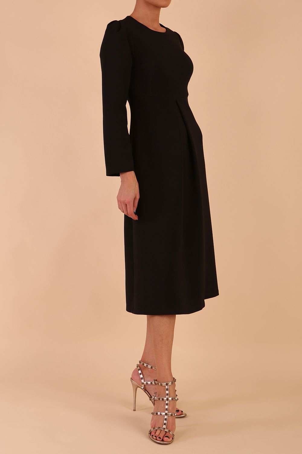 Model wearing diva catwalk in Bombay fabric the Epsom Long Sleeve and round neckline and midi A-Line Dress in Black colour front side (Black)