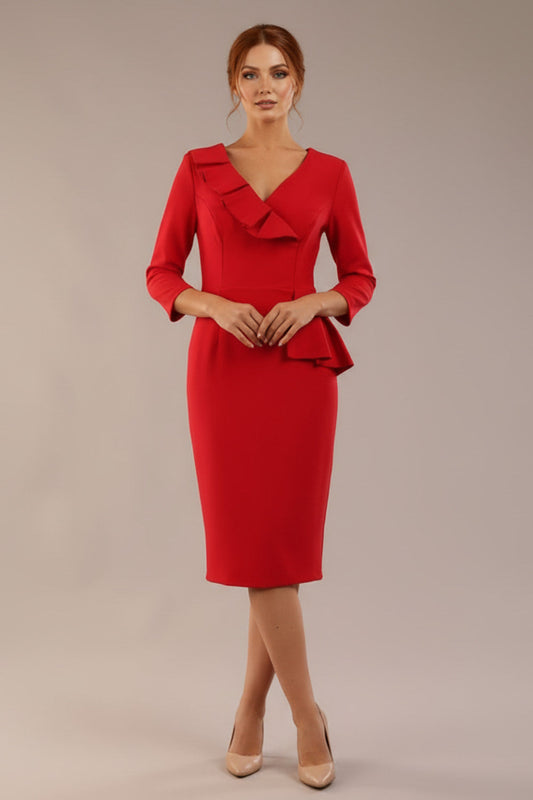 A woman modeling the diva catwalk SEED Dolores cascade ruffle pencil dress in salsa red with a v-neckline and concealed zip at the back (Salsa Red)