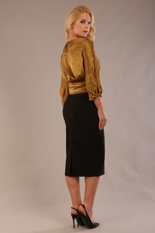 Model wearing a Hollywood lustre gold top with a blouson silhouette and a black pencil skirt close up (Rich Gold)