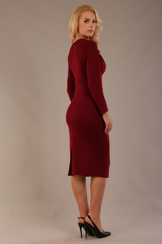 Woman wearing The Cassidy cowl neck dress in rich claret red, showing the ruched waist detail, against a plain background (Claret Red)