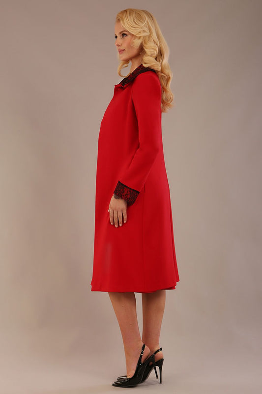 Model wearing the Haven lace trim midi coat in salsa red, styled with the matching Lovell dress (Salsa Red)