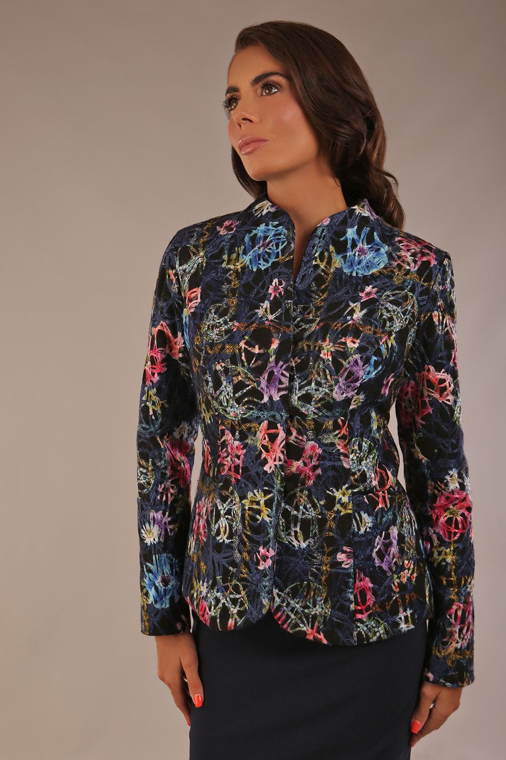 The Keanu floral jacket layered over a pink A-line dress for an elegant occasion look (Nightshade Bloom)