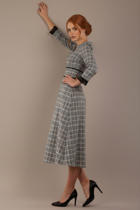 Model wearing the Hendricks check midi dress in misty grey with black lace cuffs and a V-neck (Misty Grey Check)