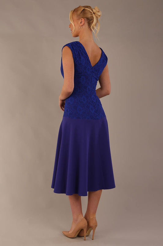 Model wearing the Ayesha lace bodice A-line dress in spectrum indigo. (Spectrum Indigo)