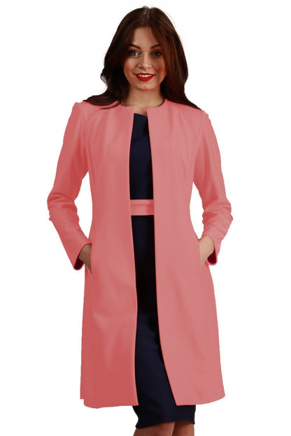 model wearing diva catwalk peach coat with long sleeves and a belt front