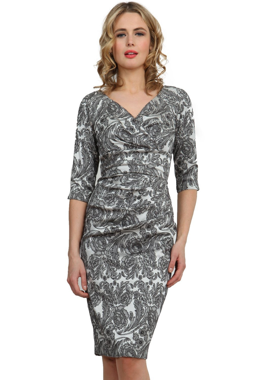 brunette model wearing diva catwalk venice jacquard pancil fitted summer dress with sleeves and low v-neckline in black colour front