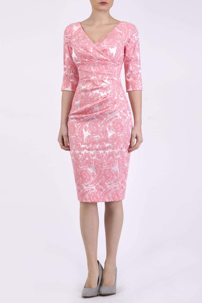 brunette model wearing diva catwalk venice jacquard pancil fitted summer dress with sleeves and low v-neckline in pale pink colour front