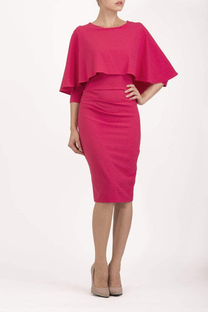 model wearing diva catwalk lizanne pencil-skirt dress with an attached wide cape detail and 3 4 sleeves in colour Dazzle pink back
