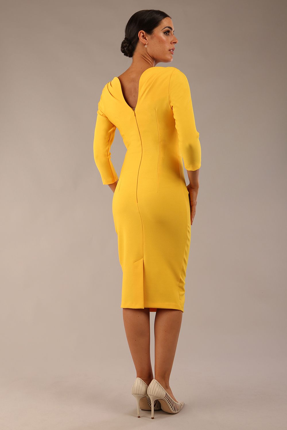 Model wearing the Seed Agatha in pencil dress design in daffodil yellow front image