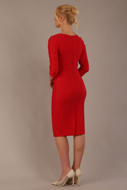 Woman wearing a diva catwalk salsa red Seed Greenwich Sleeved Pencil Dress with a plain background