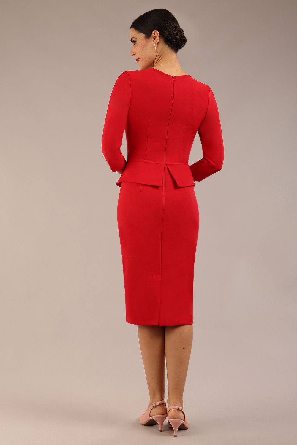 Brunette Model is wearing a three quarter sleeve couture seed pencil dress frill side detail by Diva Catwalk in salsa red