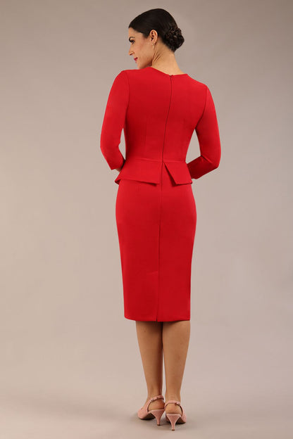 Brunette Model is wearing a three quarter sleeve couture seed pencil dress frill side detail by Diva Catwalk in salsa red