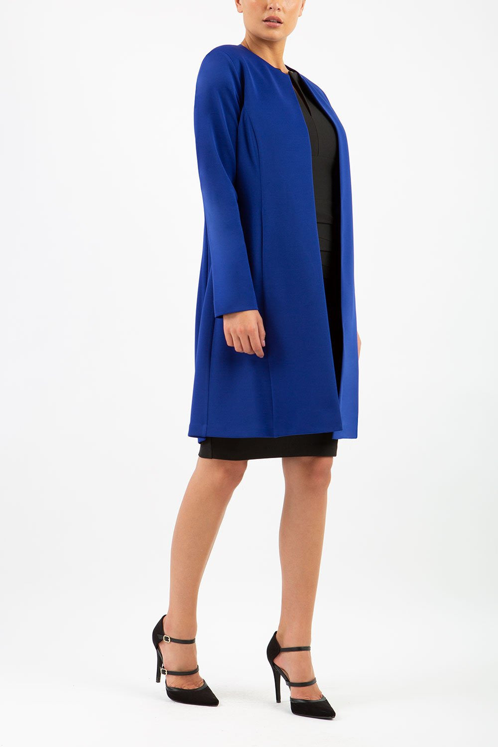 model wearing diva catwalk navy blue coat with long sleeves and a belt front