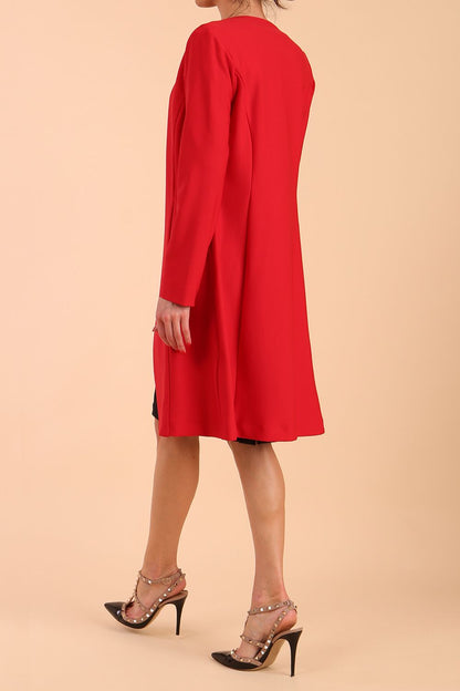 model wearing diva catwalk teal coat with long sleeves and a belt in Rose Red back