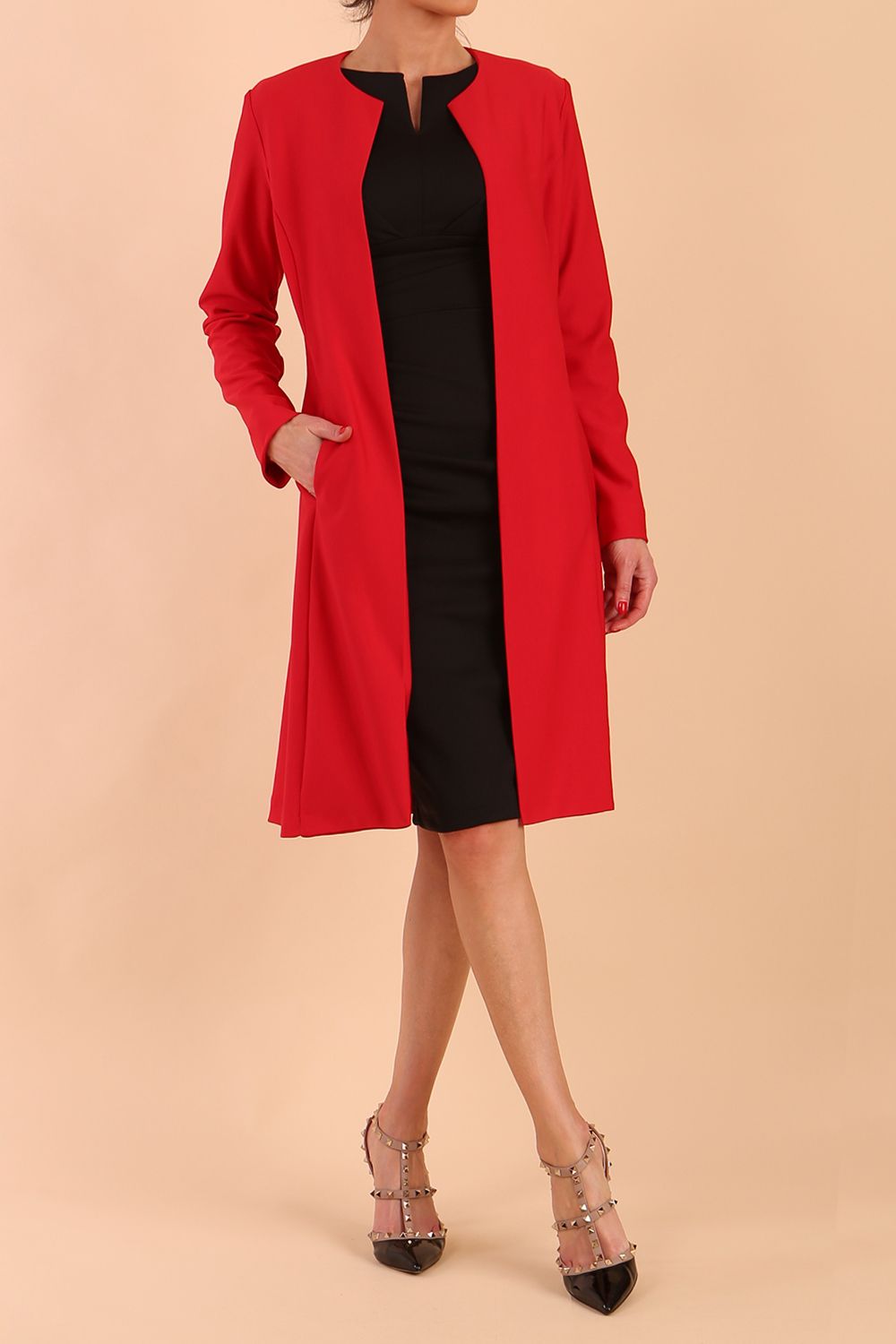 model wearing diva catwalk teal coat with long sleeves and a belt in Rose Red back