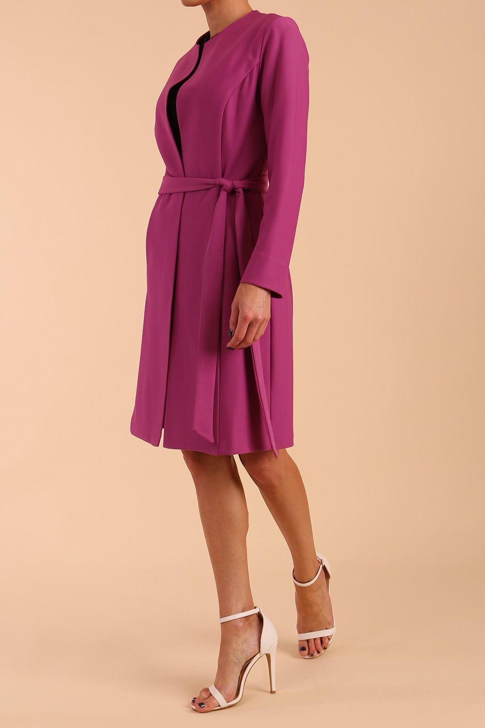 model wearing diva catwalk teal coat with long sleeves and a belt in Orchid Purple front