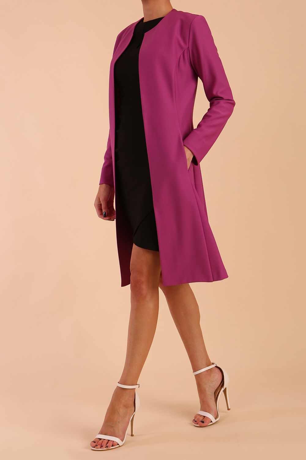 model wearing diva catwalk teal coat with long sleeves and a belt in Orchid Purple front