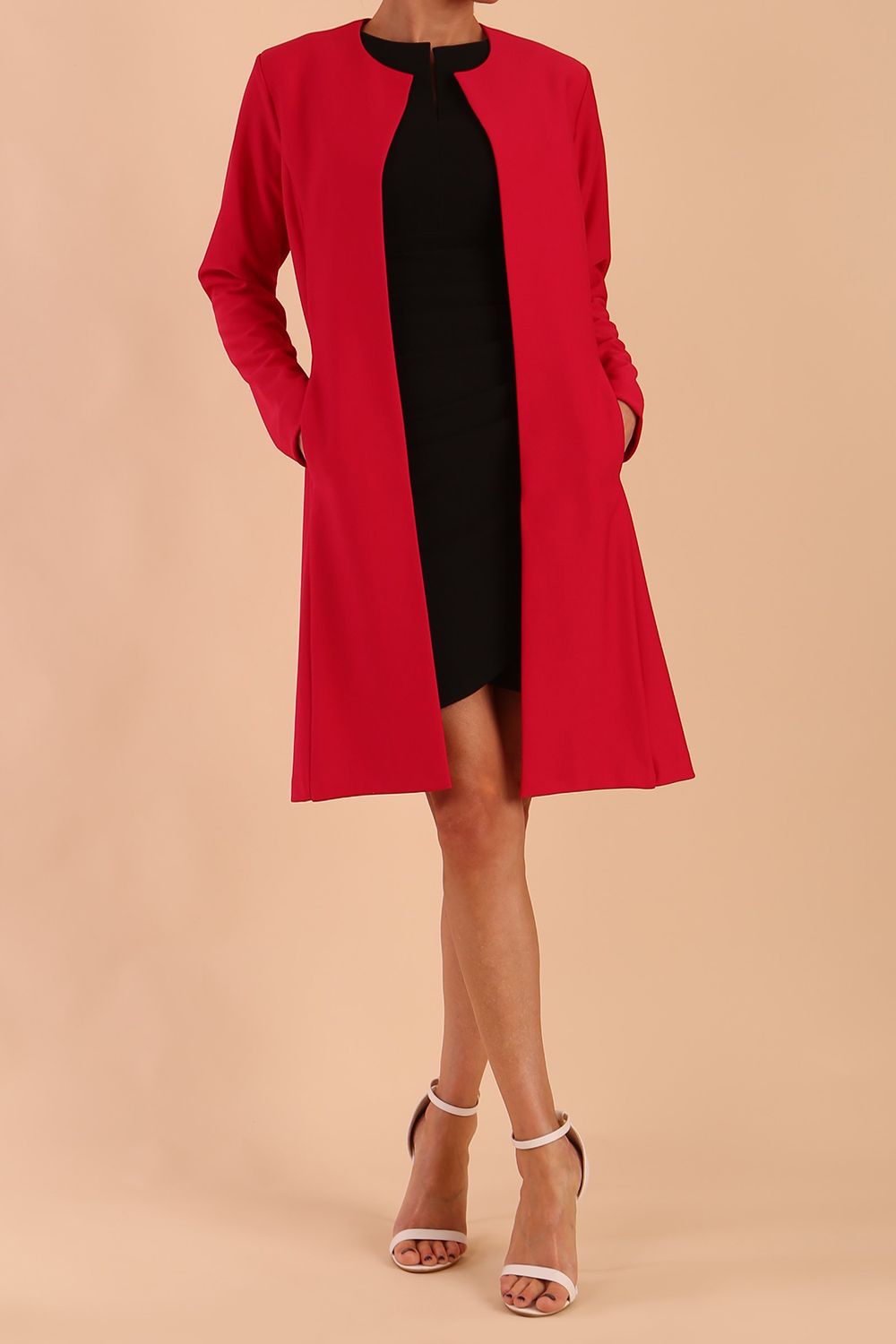 model wearing diva catwalk teal coat with long sleeves and a belt in Rose Red back