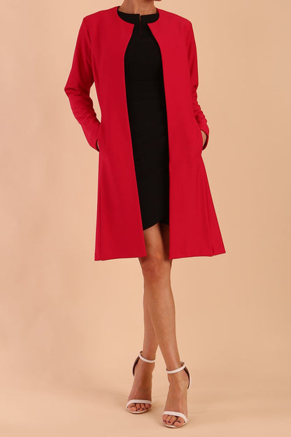 model wearing diva catwalk teal coat with long sleeves and a belt in Rose Red back