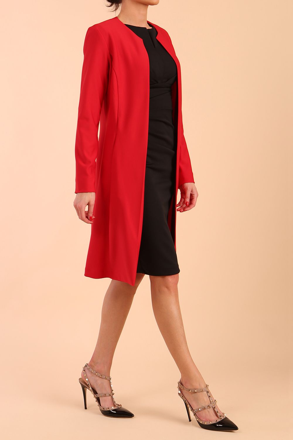 model wearing diva catwalk teal coat with long sleeves and a belt in Rose Red back
