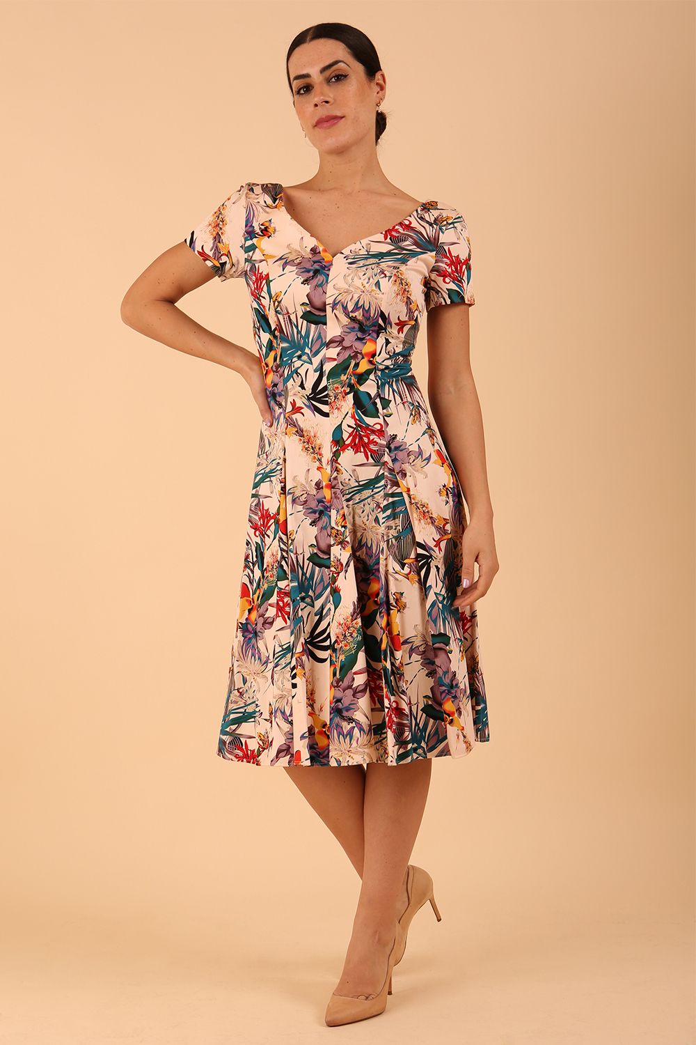 Model wearing a diva catwalk Iris Print Dress short sleeve swing skirt in Rainforest print front