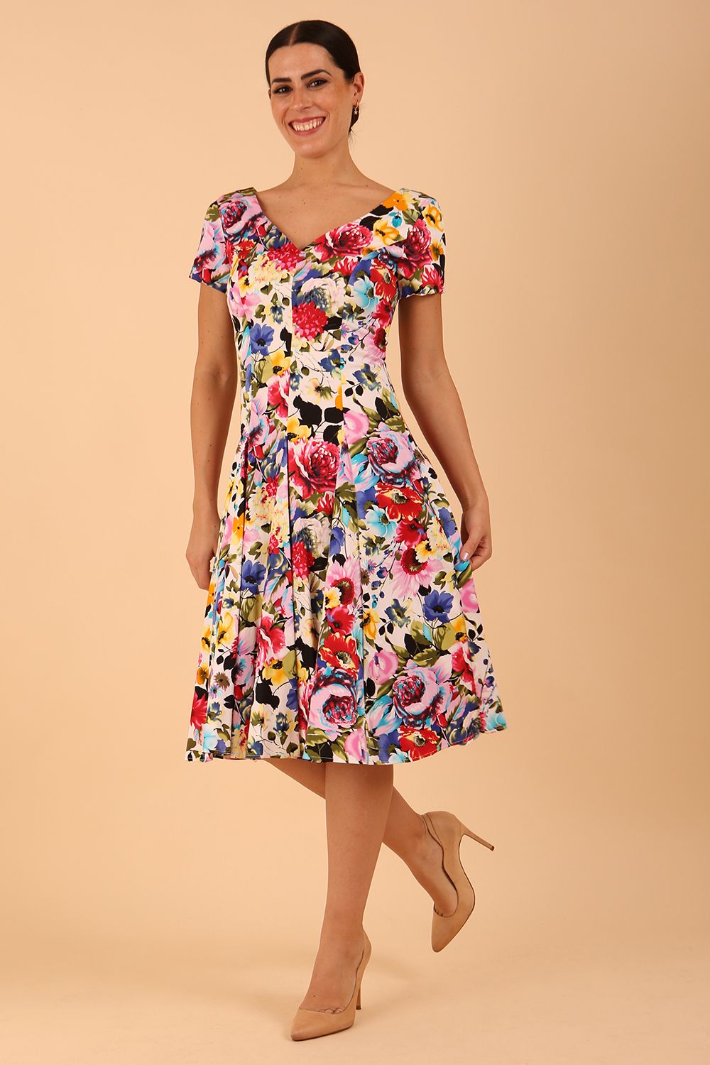 Model wearing a diva catwalk Iris Print Dress short sleeve swing skirt in Fusion Print Colour