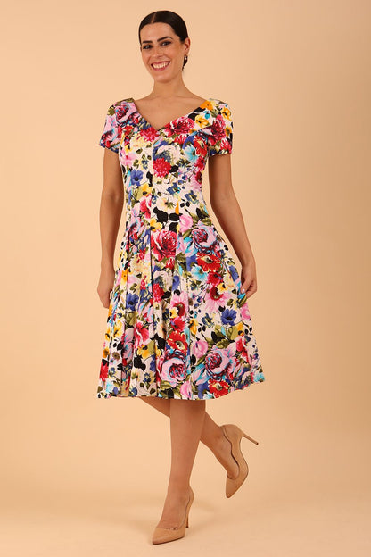 Model wearing a diva catwalk Iris Print Dress short sleeve swing skirt in Fusion Print Colour