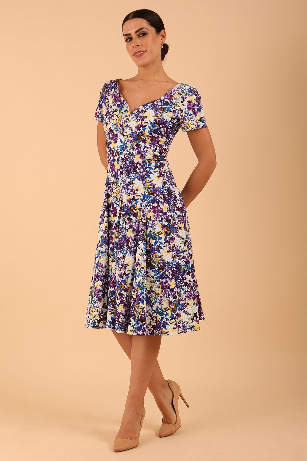 Model wearing a diva catwalk Iris Print Dress short sleeve swing skirt in Kew print front