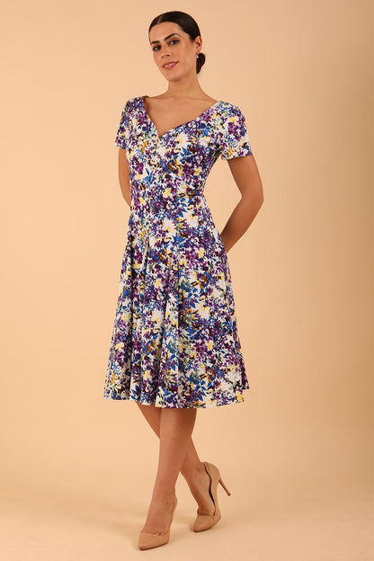 Model wearing a diva catwalk Iris Print Dress short sleeve swing skirt in Kew print front