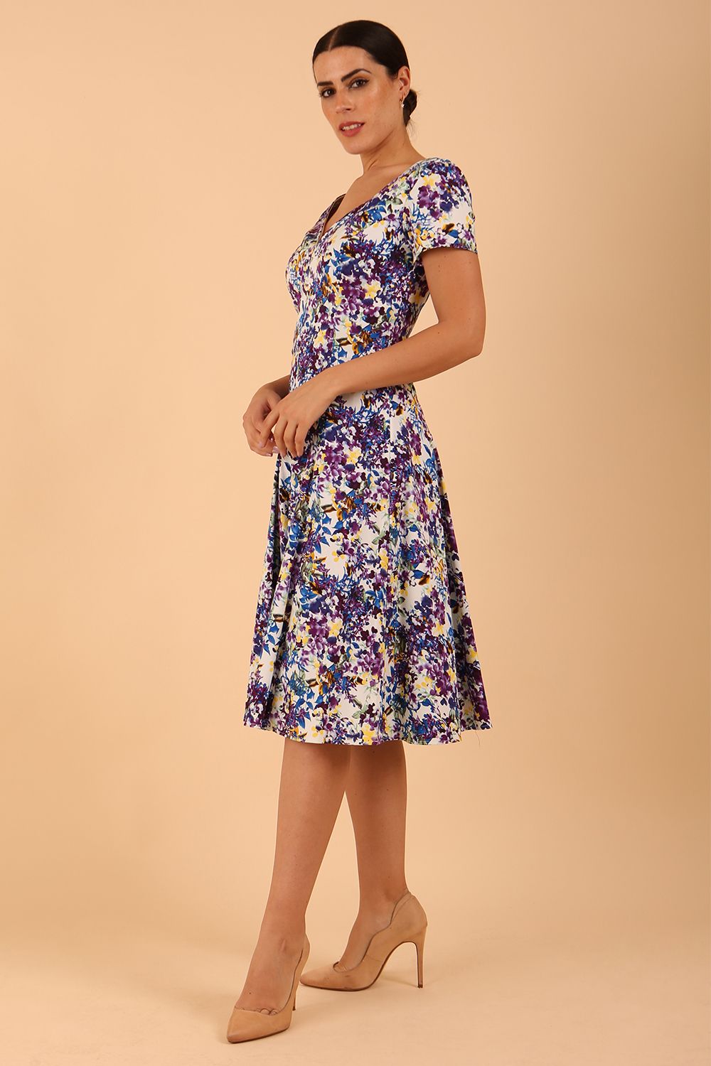 Model wearing a diva catwalk Iris Print Dress short sleeve swing skirt in Kew print front
