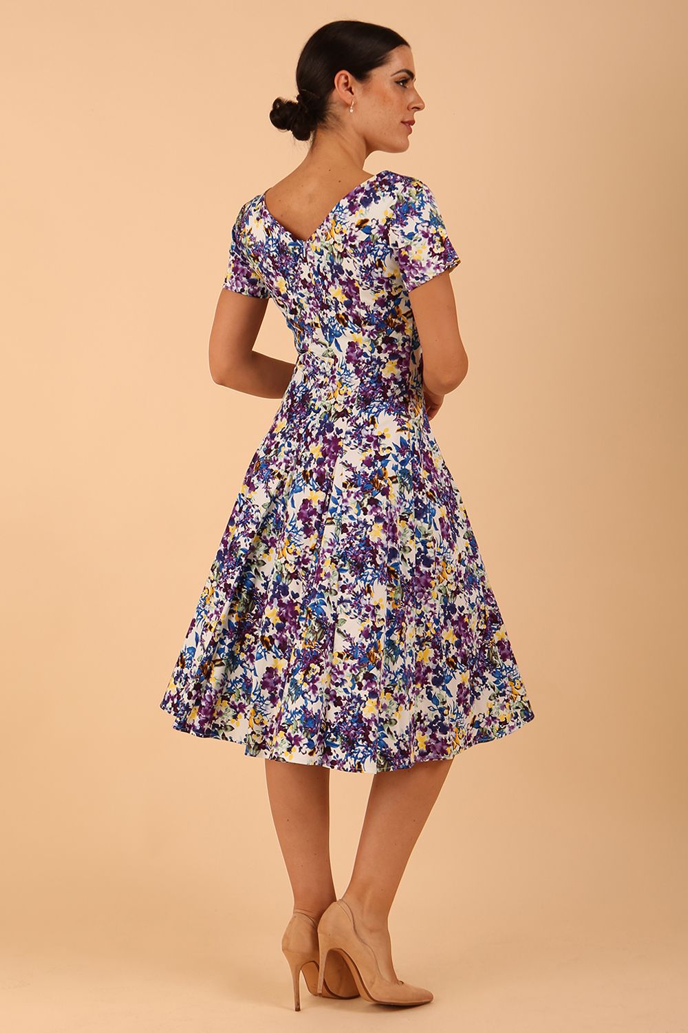 Model wearing a diva catwalk Iris Print Dress short sleeve swing skirt in Kew print front