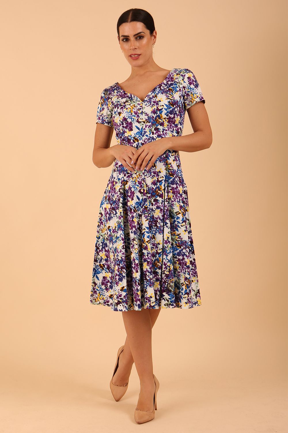 Model wearing a diva catwalk Iris Print Dress short sleeve swing skirt in Kew print front