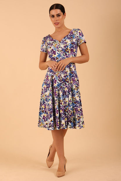 Model wearing a diva catwalk Iris Print Dress short sleeve swing skirt in Kew print front