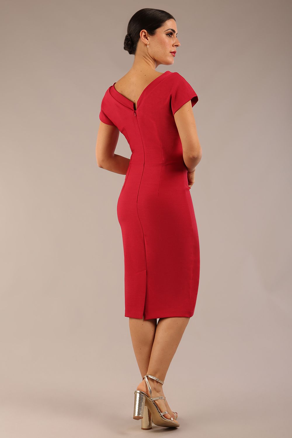 brunette model wearing a diva catwalk Seed Leela Rounded Neckline Cap Sleeved Pencil dress Dress in crimson pink colour front side