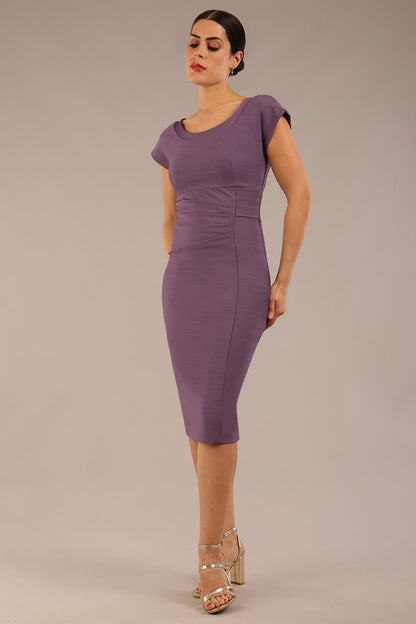 brunette model wearing a diva catwalk Seed Leela Rounded Neckline Cap Sleeved Pencil dress Dress in dusky lilac colour front