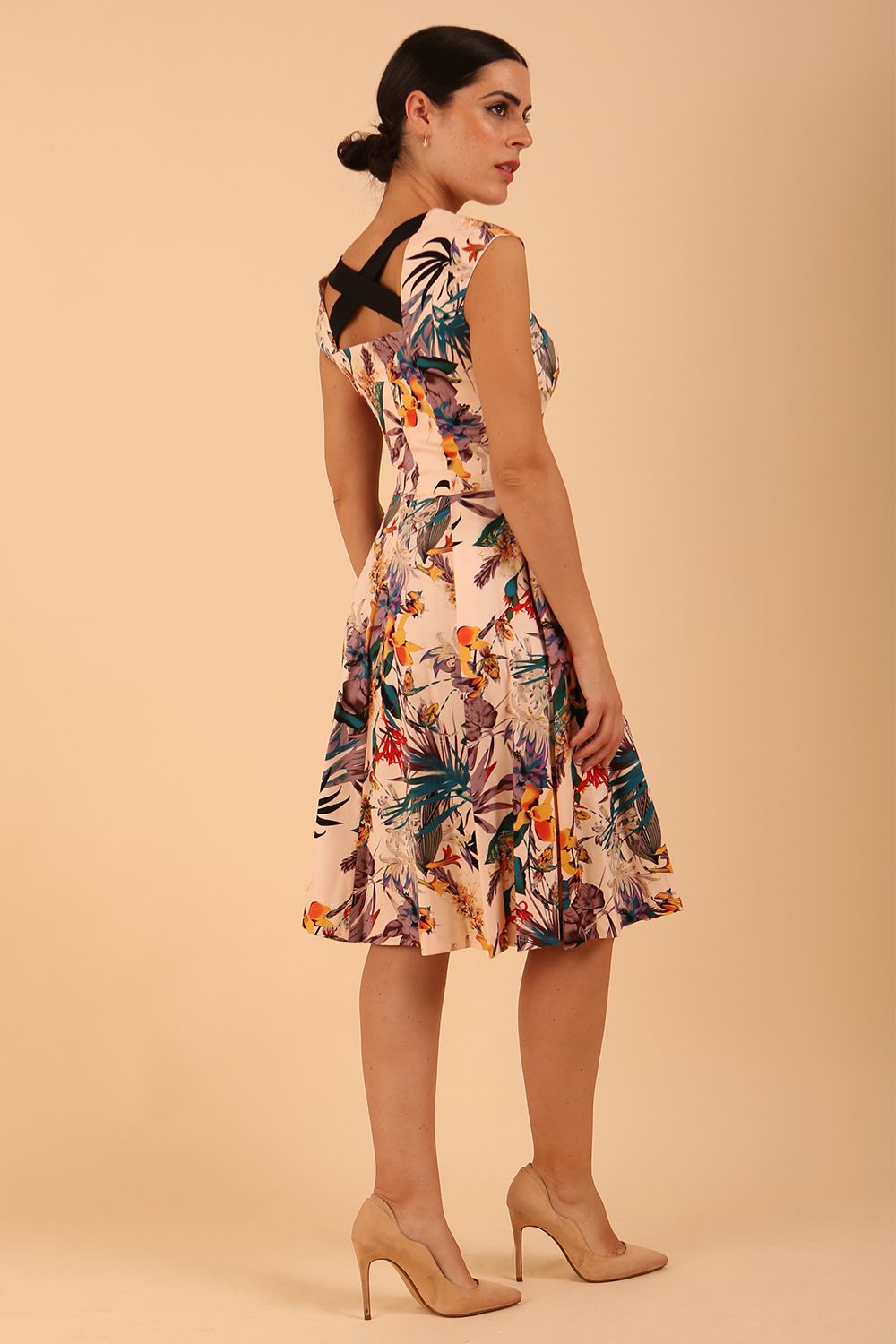 model wearing a diva catwalk Shayla Swing Dress sleeveless swing skirt dress in rainforest print colour front