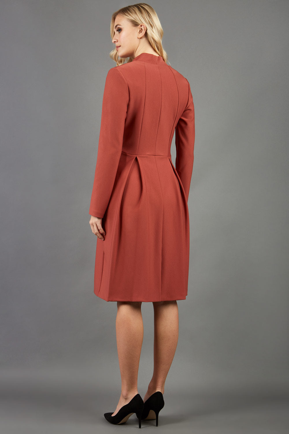 Blonde hair model wearing long sleeve bi stretch Taylor coat in Marsala Brown front image (Marsala Brown)