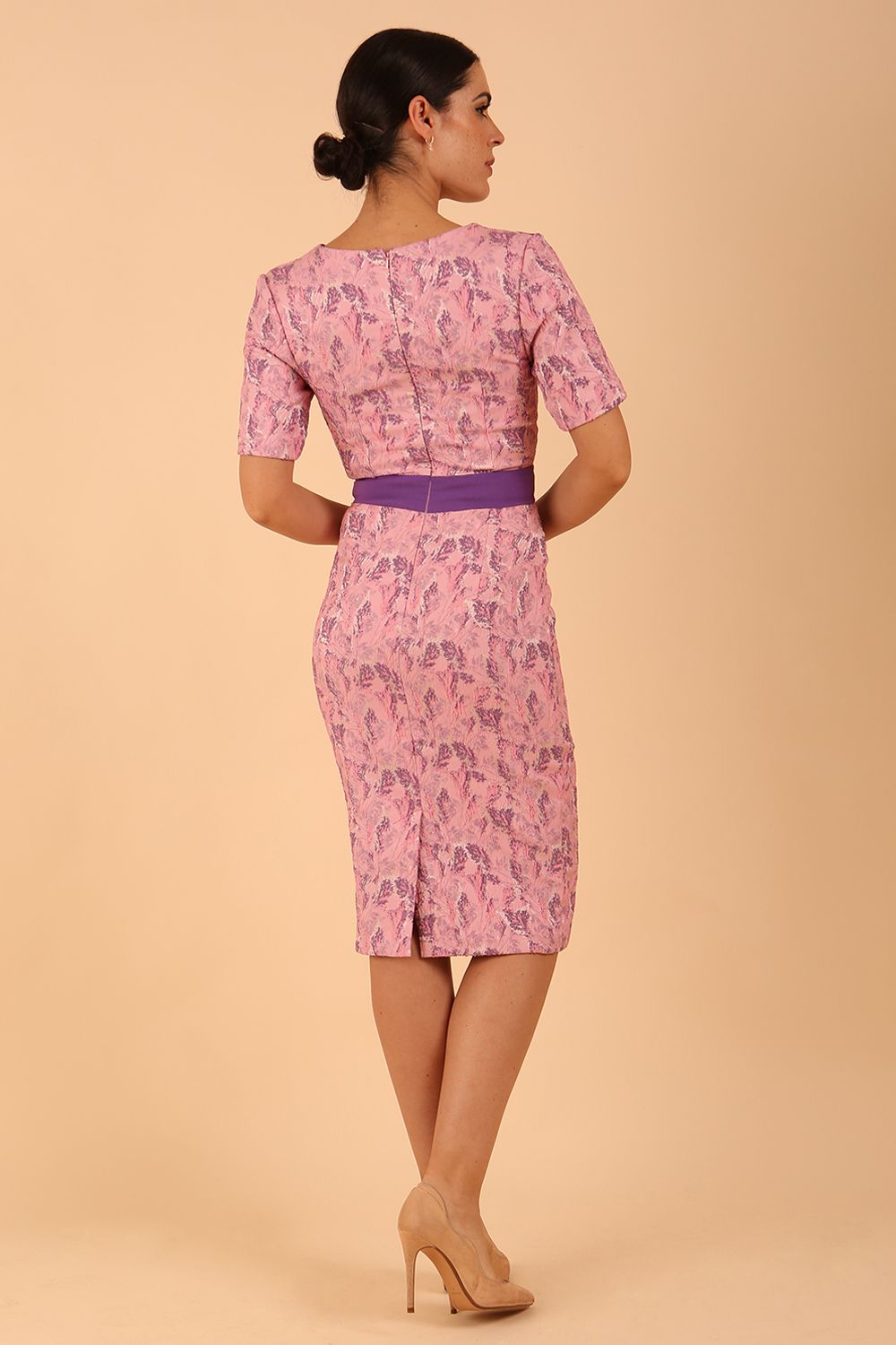 model wearing a diva catwalk Floella Jacquard Dress shor sleeves pencil dress in jacquard fabric in pink lavender with purple waistband contrast colour front side
