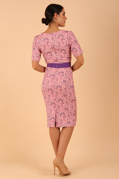 model wearing a diva catwalk Floella Jacquard Dress shor sleeves pencil dress in jacquard fabric in pink lavender with purple waistband contrast colour front side