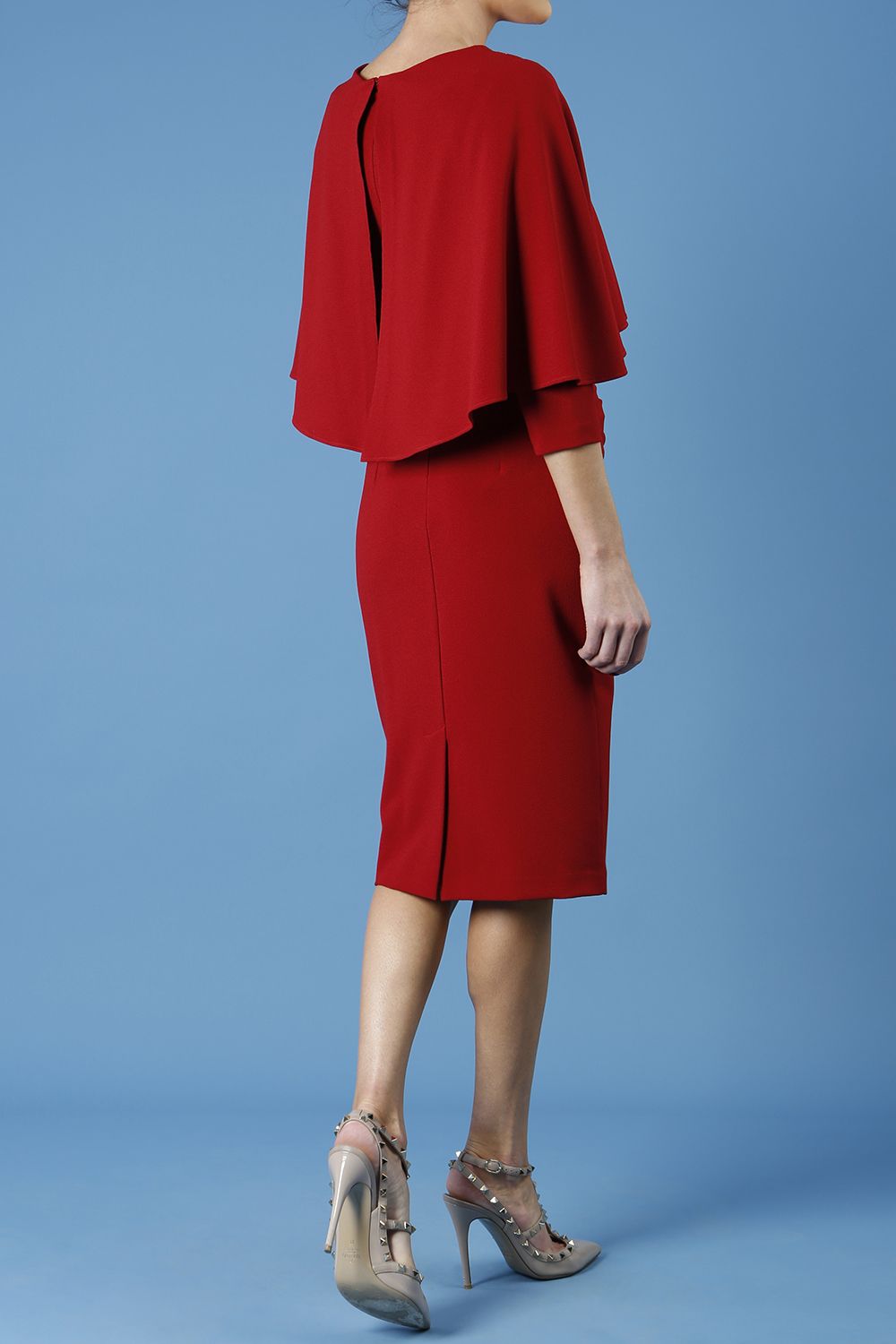 model wearing diva catwalk lizanne pencil-skirt dress with an attached wide cape detail and 3 4 sleeves in colour rosewood red front
