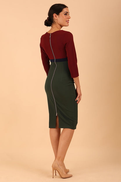 model wearing a diva catwalk Nadia 3/4 Sleeve Colour Block Dress 3/4 sleeve pencil dress exposed zip at the back in Deep Green + Burgundy + Navy Blue colour front