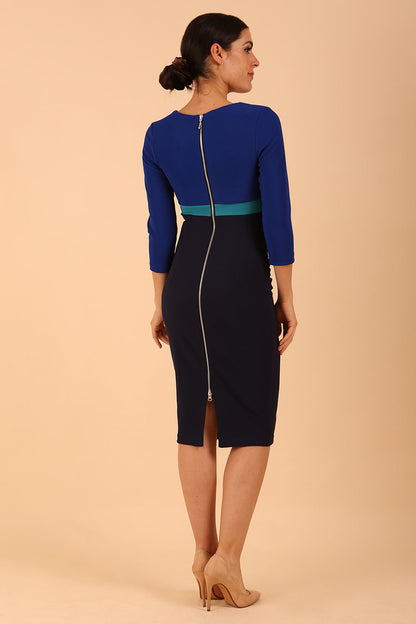 model wearing a diva catwalk Nadia 3/4 Sleeve Colour Block Dress 3/4 sleeve pencil dress exposed zip at the back in  Navy Blue + Cobalt Blue + Mosaic Blue colour front