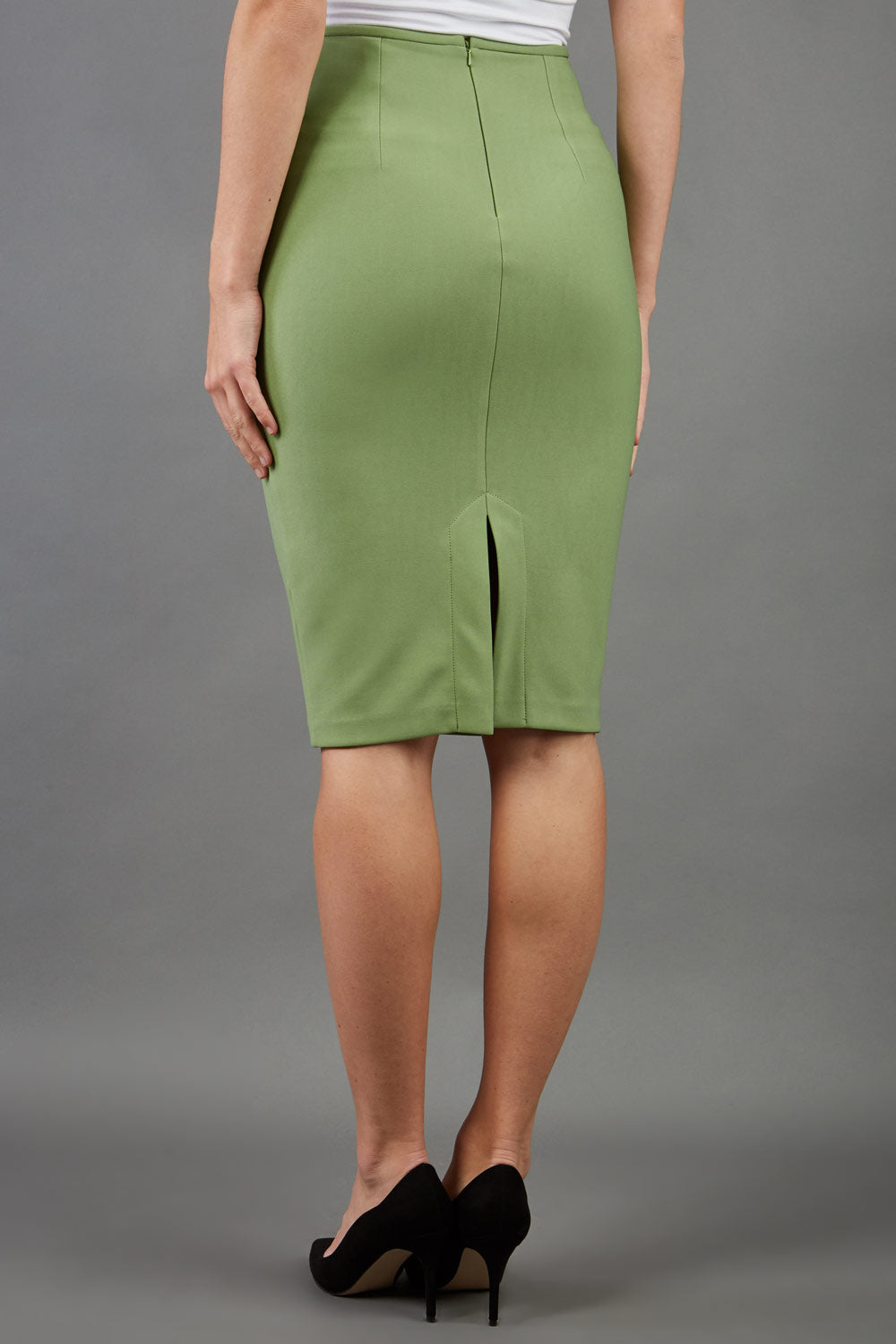 blonde model is wearing diva catwalk pencil skirt in aspen green front